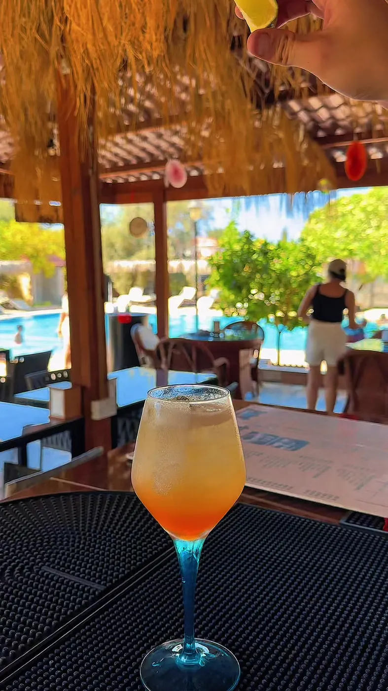 A cocktail at the thatched pool bar
